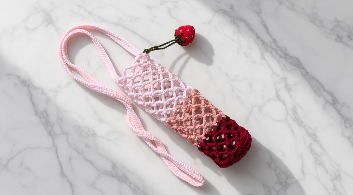 The Crochet Bottle Holder with Strawberry charm